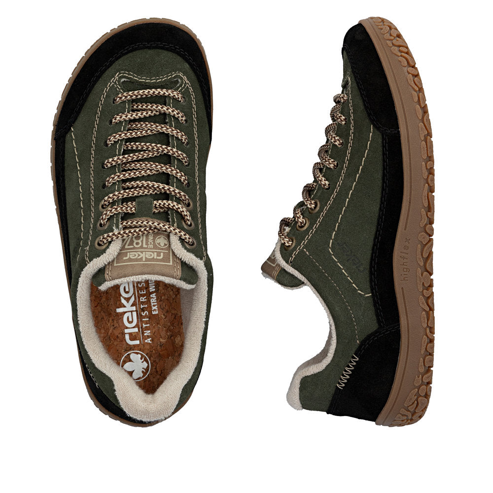 Green sneakers with brown accents on a white background