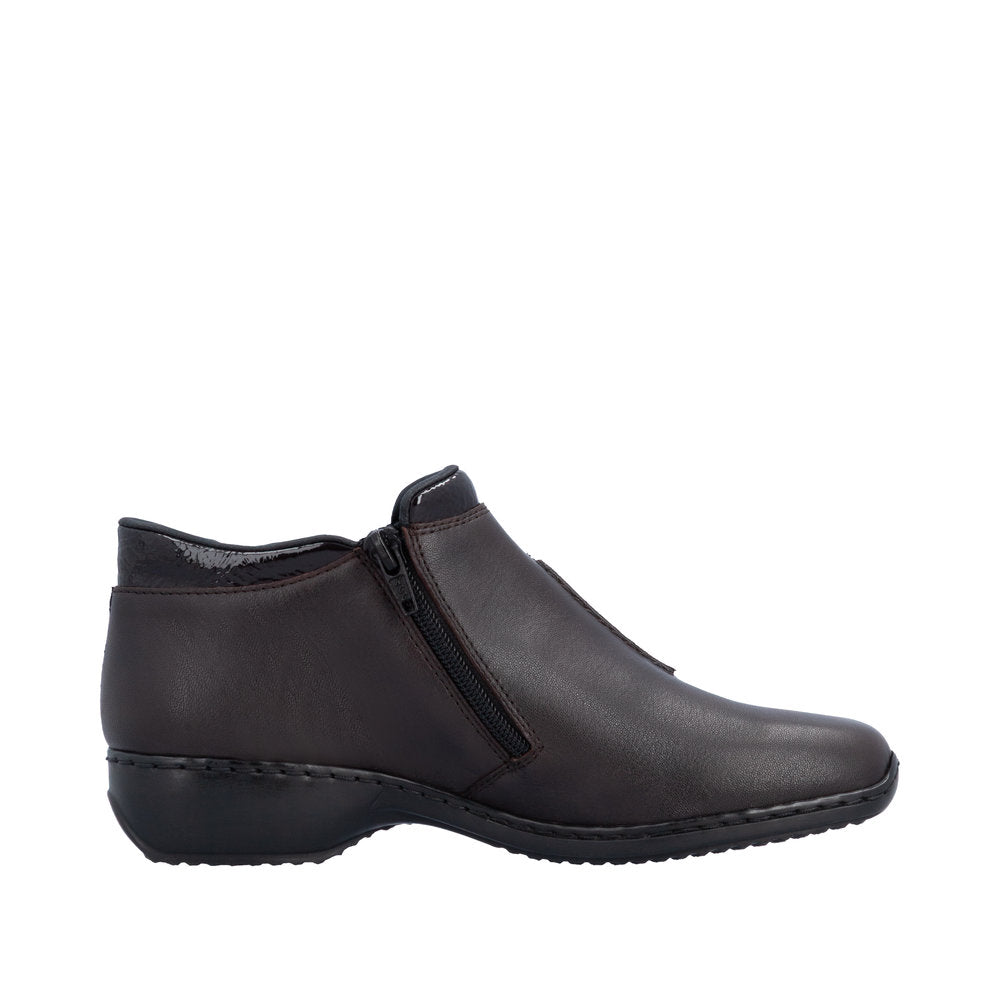 Black ankle boot with a zipper on a white background