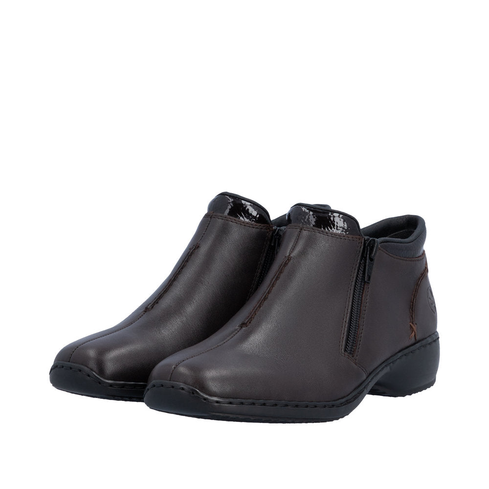Pair of brown leather ankle boots on a white background